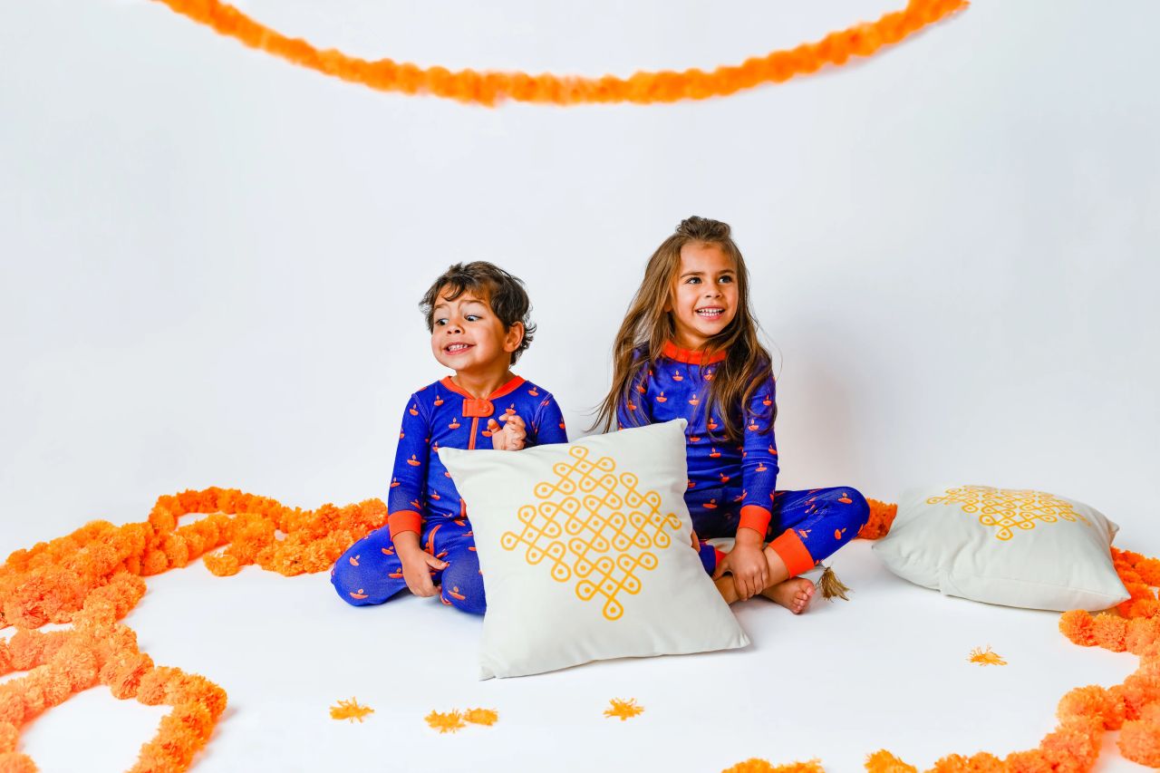 Baby and Toddler wearing organic cotton Diwali pajamas